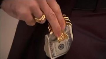 Golden Dragon Money Clip de Castor Troy (Nicolas Cage) como se ve en Face/Off