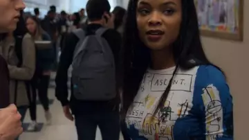 Alice + Olivia  AO X Basquiat Long Sleeve Crop Top worn by Sheri Holland (Ajiona Alexus) seen in 13 reasons why S02E08