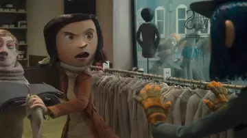 Costumes from the animated film Coraline: Coraline (Dakota Fanning) wears multicolored gloves