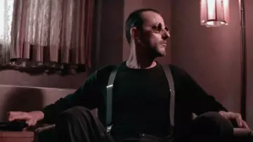 Les lunettes de soleil rondes à monture transparente portées par Léon (Jean Reno) dans le film Léon
