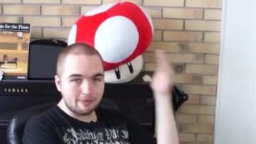 The stuffed Mushroom Mario in the YouTube video Madame Pavoshko - Black M (critique) of LinksTheSun