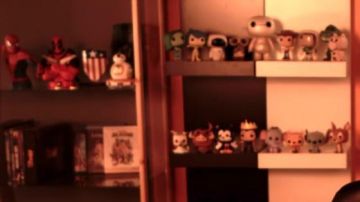 La figurine Funko Pop Rex dans la vidéo YouTube Les Nouvelles Aventures d'Aladin - 50/50 (critique) de LinksTheSun