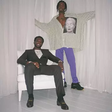 The pants purple Palm Angels Trackpants of Playboi Carti on his account Instagram