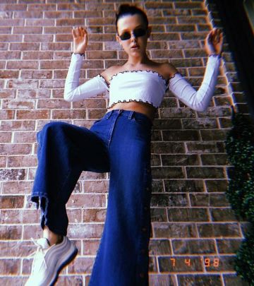 The pair of Nike Air Max 97 White worn by Millie Bobby Brown on his account Instagram