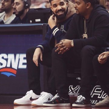 The pair of Nike Air Force 1 Low White 'Travis Scott' as worn by Drake at a basketball game