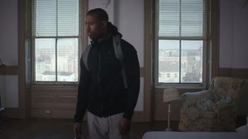 The gray Herschel Supply Co. backpack worn by Adonis Creed (Michael B. Jordan) in the movie Creed
