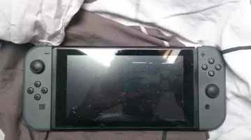 Nintendo Switch with a pair of Joy Con grey