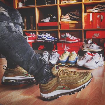 The pair of Nike Air Max 97 Metallic gold bullet view on the post Yoan Kicks on his account Instagram