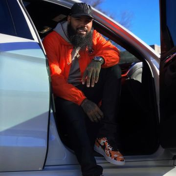 les sneakers nike air force 1 camo orange portée par stalley sur son post instagram