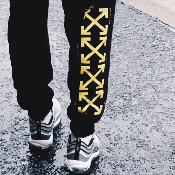 The black pants with yellow crosses off white on the account Instagram @bump_official