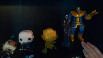 the figurine of Thanos is The Death in the video VISIT my NEW DECOR GEEK !#ChallengeLaChaineDuGeek