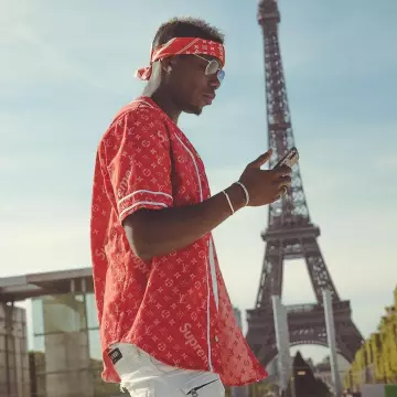 Louis Vuitton x Supreme red shirt worn by Paul Pogba on his Instagram account
