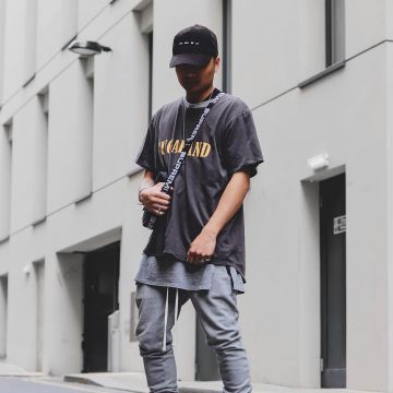 The bag is black, Supreme box logo that is on the influencer John Melchico-Bronx on his Instagram