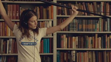 The t-shirt "some college I didn't go to" blue and white Tipper (Dree Hemingway) in While We're Young