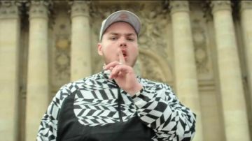 The Nike jacket printed all over the black and white of Remy in "Bella Ciao". It is Remy !