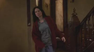 The grey tank top prints elephants Joan Watson (Lucy Liu) in Elementary S05E17