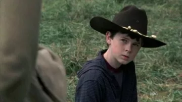 The felt hat brown Carl Grimes (Chandler Riggs) in The Walking Dead S02E11