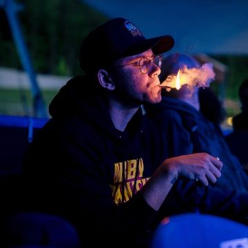 The eye glasses round frame metal Giorgio Armani worn by Sir Robert Bryson Hall II aka Logic who smokes on his account Instagram