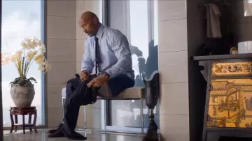 The shirt is light blue worn by Will Sawyer (Dwayne Johnson) in Skyscraper