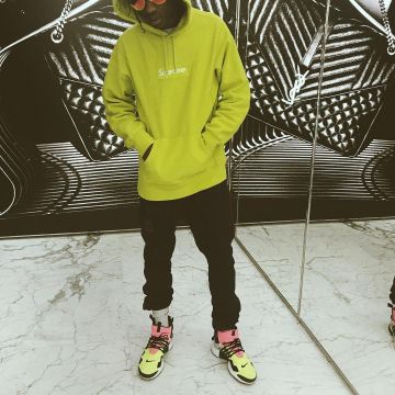 The yellow sneakers Nike Air Presto Mid / Acronym "acronym" worn by Travis Scott on his Instagram account