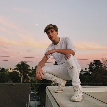 Shoes white Converse All Star Hi Optic White worn by Alex Lange on his account Instagram