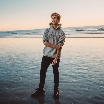 The shoe black Adidas Yeezy boost 350 V2 worn by Alex Lange on his account Instagram