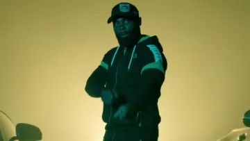 The black jacket Kappa range by Kaaris in her video clip G. O. K. O. U