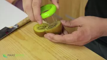 Cut kiwi in the video "8 Innovative Kitchen Gadgets" by Davy Devaux on his channel How To Make Sushi