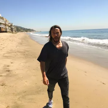 Sneakers black and white Adidas Superstar worn by Bob Sinclar on his account Instagram