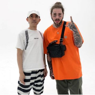 The orange t-shirt Carhartt worn by Post Malone on his account Instagram