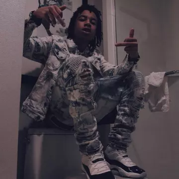 Sneakers blue Nike Air Jordan 11 Retro UNC Win Like 82 that bears the rapper YBN Nahmir on his instagram