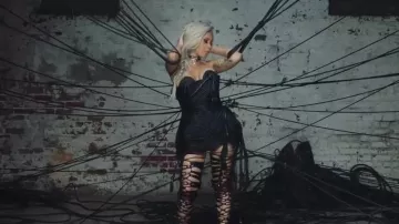 Black leather lace up legpieces worn by Cardi B in her video clip "Ring" featuring Kehlani