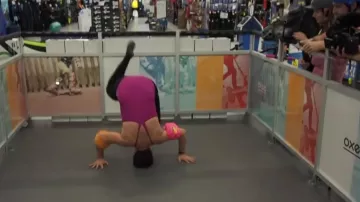 The swimming armbands orange and pink worn by Peter Croce in his video "all alone in a decathlon"