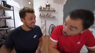 The Nike t-shirt black worn by Peter Croce in his YouTube video "The worst delusions of the rich #2"