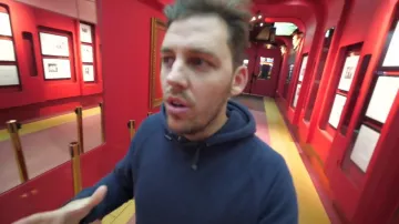 The blue sweater worn by Peter Croce in his video "hide-and-seek in a museum"