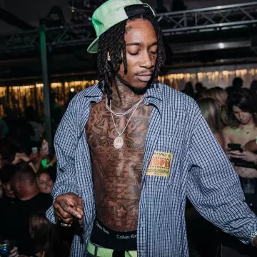 La chemise à carreaux 'Utopia' by Martine Rose de Wiz Khalifa sur son compte Instagram