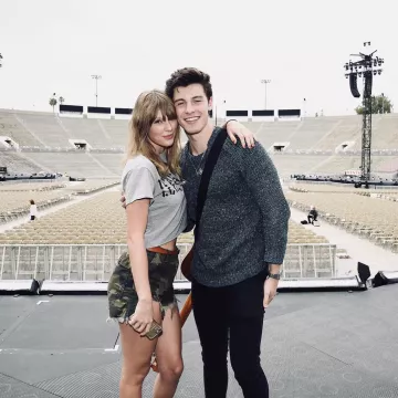 R13 Distressed Camo short worn by Taylor Swift in a stadium on Instagram