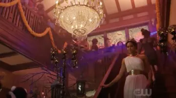 The white dress ancient created by Mandi Line carried by Macy Vaughn (Madeleine Mantock) in Charmed S01E03