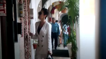 The tailor striped white Eleanor Young (Michelle Yeoh) in Crazy Rich Asians