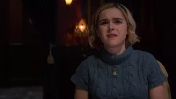 The blue sweater short sleeves and turtleneck of Sabrina Spellman (Kiernan Shipka) in The New Adventures of Sabrina S01E06