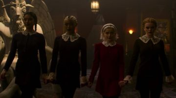 The red dress with peter pan collar in lace worn by Sabrina Spellman (Kiernan Shipka) in The New Adventures of Sabrina S01E10