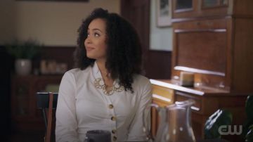 The top white asymmetrical buttons Tibi carried by Macy Vaughn (Madeleine Mantock) in Charmed S01E05