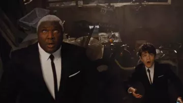 The slim tie black Butler (Nonso Anozie) in Artemis Fowl