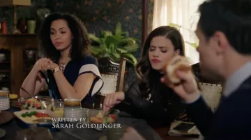 The combination of navy blue Eva Franco carried by Macy Vaughn (Madeleine Mantock) in Charmed S01E07