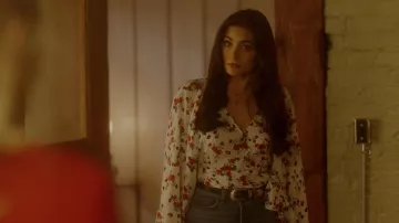 The blouse with flowers A. L. C. worn by Crystal Jennings (Ana Brenda Contreras) in Dynasty S02E07