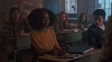 The ribbed top mustard with sleeves buttoned from Josie McCoy (Ashleigh Murray) in Riverdale S03E06