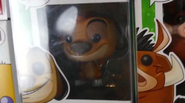 The figurine Funko Pop Timon in the video "MY ENTIRE COLLECTION OF FUNKO POP !!"