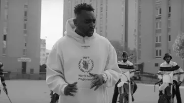 The sweatshirt white Balenciaga x World Food Program Mac Tyer in her video clip by Chance