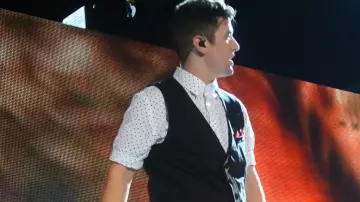 The shirt worn by Logan Henderson in the YouTube video Big Time Rush Summer Tour. I Wanna Hold Your Hand & Help. 7.14.12. Dallas