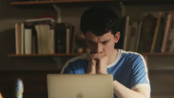 Otis' (Asa Butterfield) blue t-shirt as seen in Sex Education S01E08